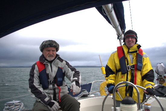 James helming and smiling at Skipper's advice